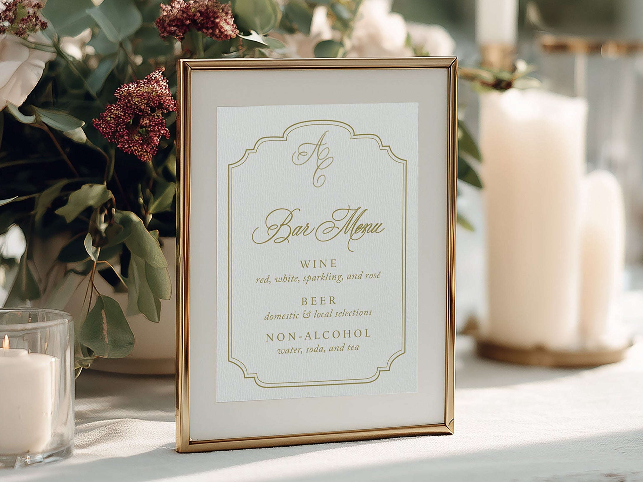 Decorative table setting with flowers, candles, and a bar menu sign.