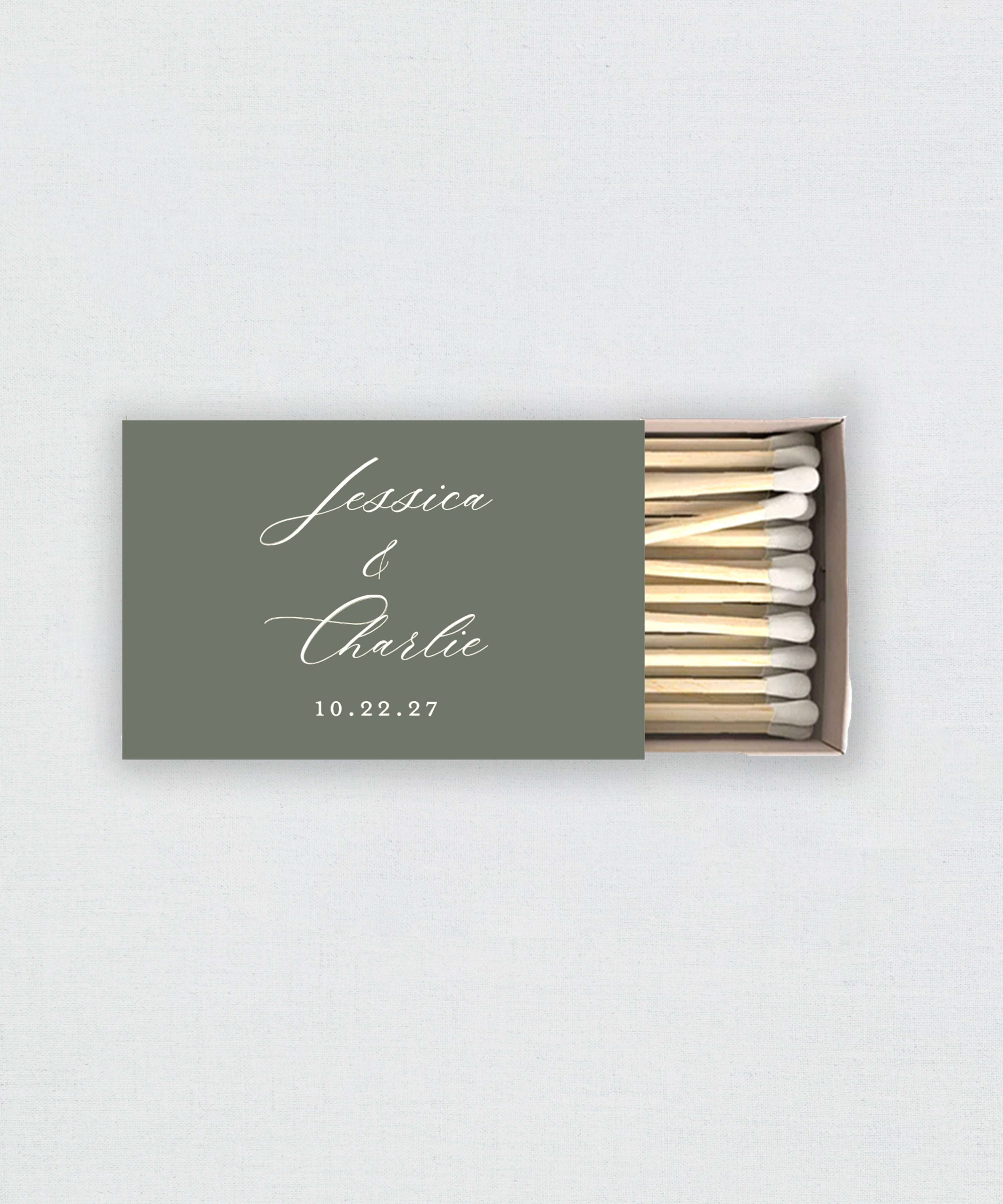 Matchbox with personalized text on a light gray background