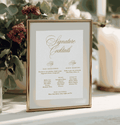 Framed cocktail menu with decorative plants and candles in the background